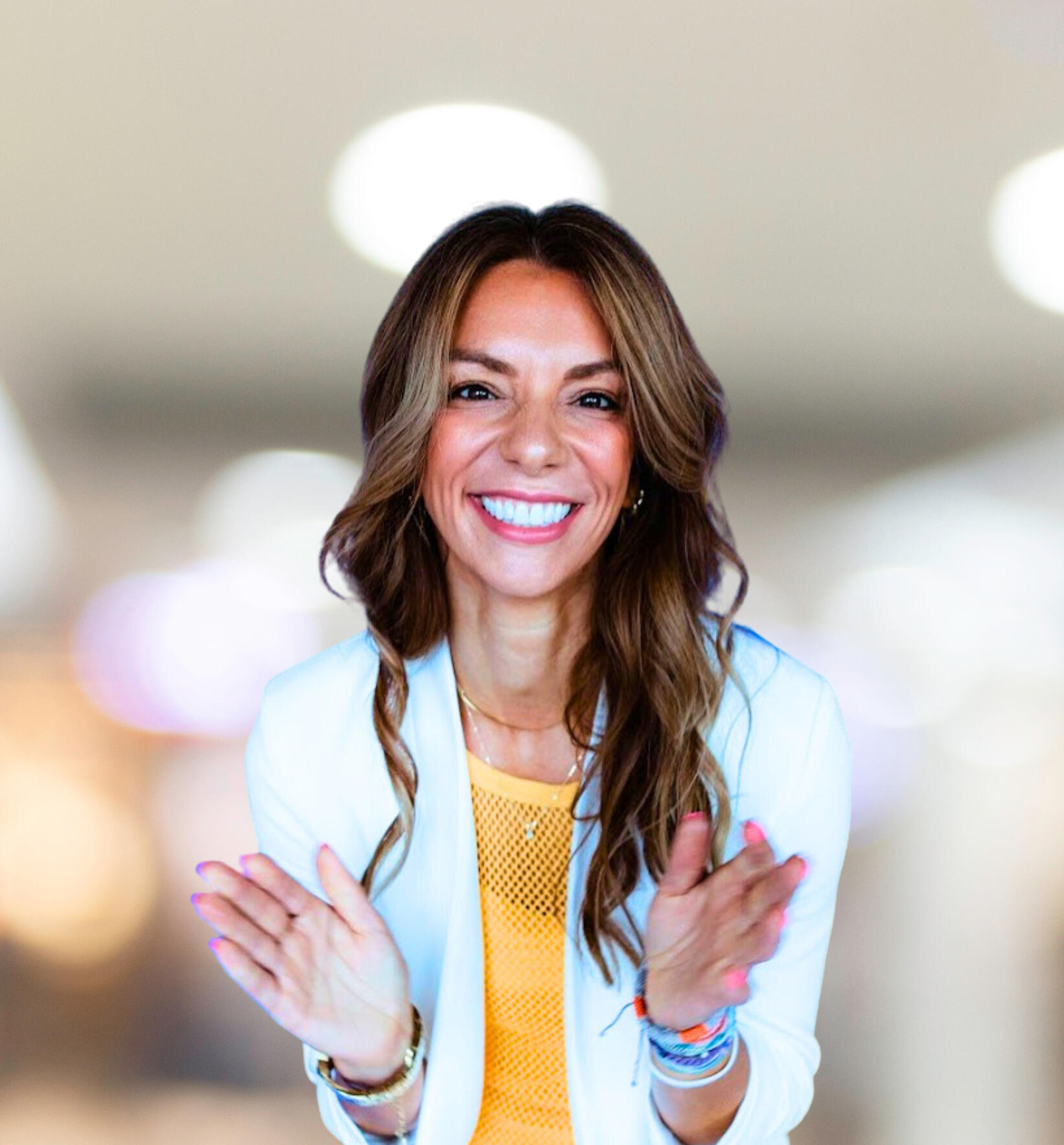 Woman with brown hair smiling.